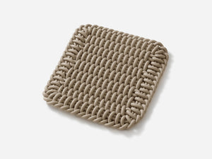 Ergonomic Shore Rug handmade from durable silicone cord suitable for both indoors and outdoors.